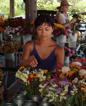 Local flowers often cost less than bouquets purchased from a conventional florist. While costs vary by region, brides typically spend 8 to 10 percent of their wedding budget on flowers.